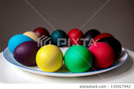 Colorful Easter eggs on a platter. Minimalist photo. Colorful Easter eggs on a platter. Minimalist photo. 138927942