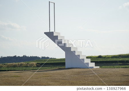 White staircase is leaning against a white wall White staircase is leaning against a white wall 138927966