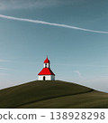 The church with the red roof on the hill 138928298