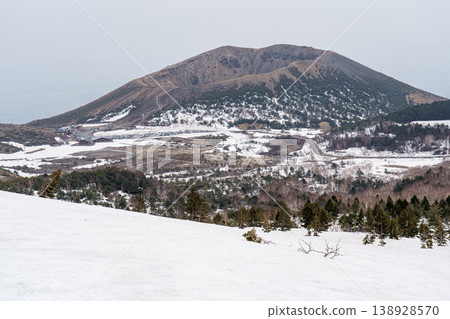 A view of Mount Azuma-Fuji from the Issaikyo-zan mountain trail in Fukushima Prefecture: A mountain landscape during the lingering snow season. A view of Mount Azuma-Fuji from the Issaikyo-zan mountain trail in Fukushima Prefecture: A mountain landscape during the lingering snow season. 138928570