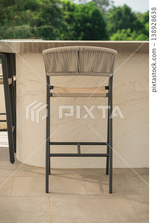 Sturdy and Stylish Bar Stool in Natural Setting with Modern Design for Outdoor or Indoor Spaces, Perfect for Home and Restaurant Use 138928638