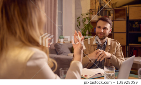 Man listening carefully to mental coach during psychological session. 138929059