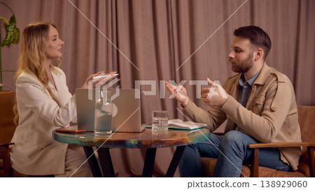 Two people discussing feelings and ideas during mental coaching session. Two people discussing feelings and ideas during mental coaching session. 138929060