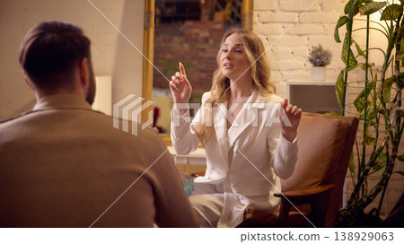 Mental coach giving advice and guidance during personal coaching session. Mental coach giving advice and guidance during personal coaching session. 138929063