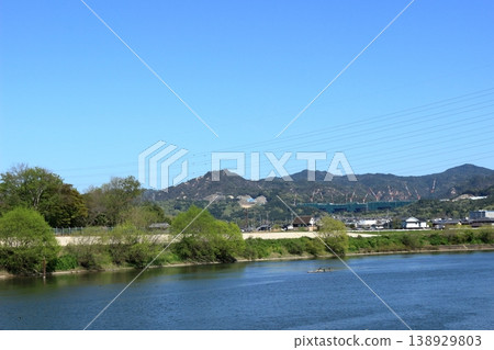 The mountain range of the Konan Alps as seen across the Setagawa River, and the expressway under construction at its base. The mountain range of the Konan Alps as seen across the Setagawa River, and the expressway under construction at its base. 138929803