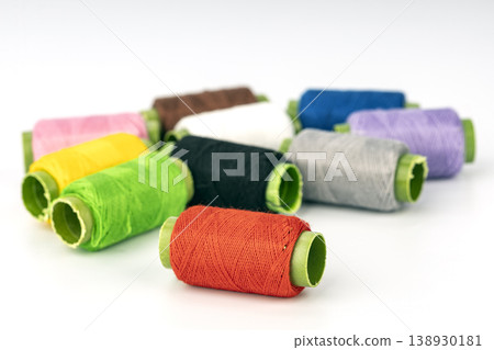 Colorful Thread Spools with Bright Green Bobbins - Professional Sewing and Embroidery Supplies Collection 138930181