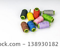 Assorted Colorful Thread Spools with Bright Green Cardboard Tubes for Sewing, Embroidery, and Craft Projects 138930182