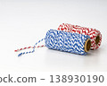 Colorful Red White and Blue Striped Baker's Twine Spools on Cardboard Rolls for Wrapping and Decoration 138930190