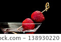 Strawberries garnishing martini glass with cocktail drink 138930220