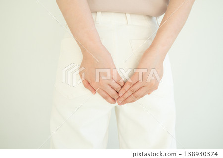 Woman suffering from anal pain and discomfort. Cause of pain include hemorrhoid, anal fissure, diarrhea, constipation or Crohn's disease. Gastrointestinal system concept. Woman suffering from anal pain and discomfort. Cause of pain include hemorrhoid, anal fissure, diarrhea, constipation or Crohn's disease. Gastrointestinal system concept. 138930374