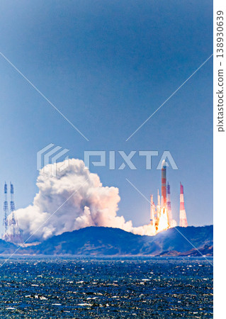 H-III rocket launch captured against the backdrop of a tropical sea. 138930639