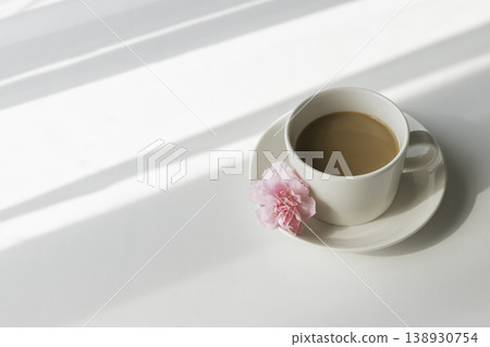 A Mother's Day image featuring café au lait and pink carnations, photographed on a bright white background with ample white space. A Mother's Day image featuring café au lait and pink carnations, photographed on a bright white background with ample white space. 138930754