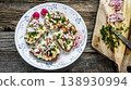 Open sandwiches with egg salad and fresh radish 138930994