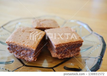 A close-up of a moist chocolate brownie. A close-up of a moist chocolate brownie. 138931572
