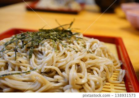 A classic Japanese lunch scene featuring zaru soba (cold buckwheat noodles). A classic Japanese lunch scene featuring zaru soba (cold buckwheat noodles). 138931573
