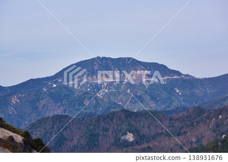 View of Yokoteyama Mountain from Manza Pass, on the border between Gunma and Nagano Prefectures. View of Yokoteyama Mountain from Manza Pass, on the border between Gunma and Nagano Prefectures. 138931676
