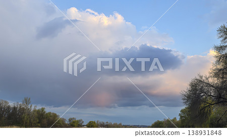 City sky with clouds, spring thunderstorms. Beautiful pink and orange clouds. 138931848