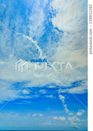 The rocket's trajectory and the clouds' expressions are painted on the sky as a canvas. 138932262