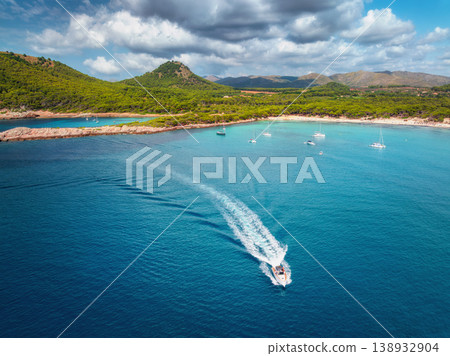Aerial view of luxury yachts and speed boats on blue sea 138932904