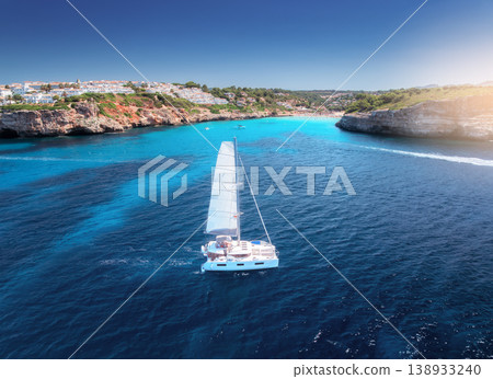 Aerial view of beautiful sailboat. Boat on the sea in summer Aerial view of beautiful sailboat. Boat on the sea in summer 138933240