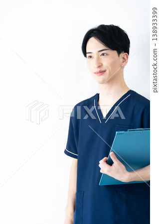 Young man wearing scrubs Young man wearing scrubs 138933399