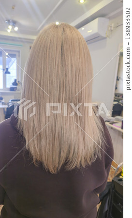 Women's haircut and coloring at the beauty salon. Hair wash. Long blonde hair. 138933502
