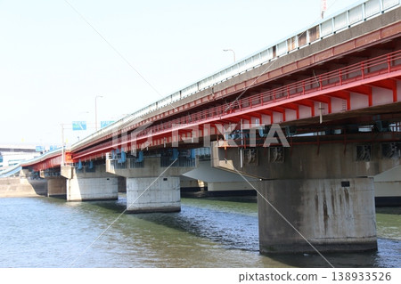A view of the Ichikawa Ohashi Bridge spanning the Edogawa River against a blue sky (National Route 357, Wangan Road) 138933526