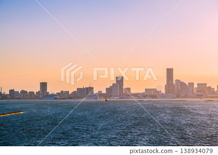 A rare sight in Yokohama, Japan: three Princess cruise ships, Asuka III and Asuka II, departing from port, and the Yokohama Kannai Tower in the background. 138934079