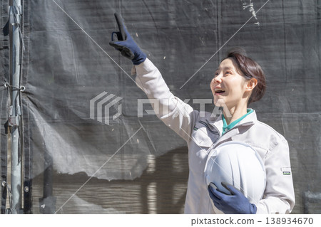 A hopeful female worker at a construction site, a construction industry staff member - portrait. 138934670