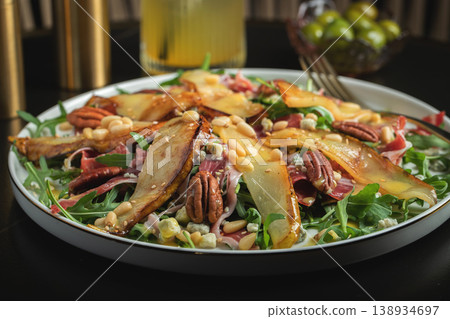 Salad with Pear, Arugula, Jamon, Blue Cheese and Blueberry, Delicious Fresh Salad Appetizer on Bright Background Salad with Pear, Arugula, Jamon, Blue Cheese and Blueberry, Delicious Fresh Salad Appetizer on Bright Background 138934697
