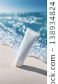 White skincare tubes standing on a sandy beach – summer product materials, easy to use in beauty advertisements promoting UV protection and moisturizing. 138934824