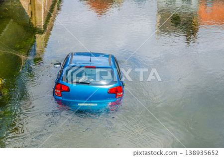 Blue vehicle drown in water canal Blue vehicle drown in water canal 138935652