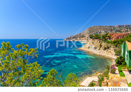 Aerial panoramic view coastline Costa Blanca coast with sandy beach, touristic path, residential houses in Calpe town 138935680