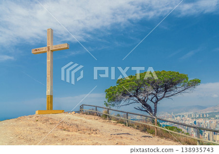 La Cruz de Benidorm La Creu giant cross on mountain hill, aerial view of Mediterranean Sea La Cruz de Benidorm La Creu giant cross on mountain hill, aerial view of Mediterranean Sea 138935743