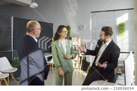 Business team discussing strategy during informal office meeting and collaboration 138936034