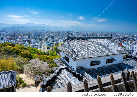 View of Nohara Turret and Matsuyama city from Matsuyama Castle keep: Historical architecture and urban landscape 138936146
