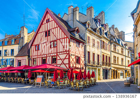 Street restaurant, cafe with tables and chairs and old typical houses colorful buildings in Dijon city Street restaurant, cafe with tables and chairs and old typical houses colorful buildings in Dijon city 138936167
