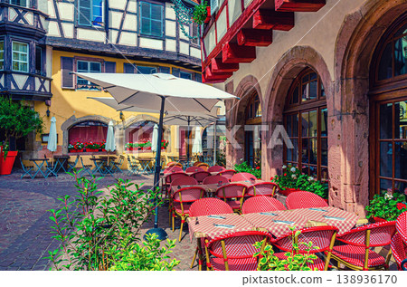Street restaurant outdoor cafe tables, chairs and umbrellas Street restaurant outdoor cafe tables, chairs and umbrellas 138936170