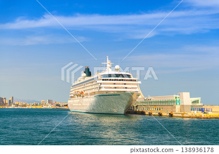 Grand cruise ship moored near pier in harbor Port of Alicante seaport Grand cruise ship moored near pier in harbor Port of Alicante seaport 138936178