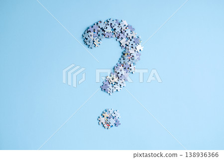 Puzzle pieces arranged in shape of large question mark on light blue background. Global conflict risks, geopolitical instability analysis, world order transition. Puzzle pieces arranged in shape of large question mark on light blue background. Global conflict risks, geopolitical instability analysis, world order transition. 138936366