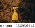 Yellow sunscreen spray bottle on dry sand beach Summer sun protection concept minimal cosmetic product mockup with copy space 138936418