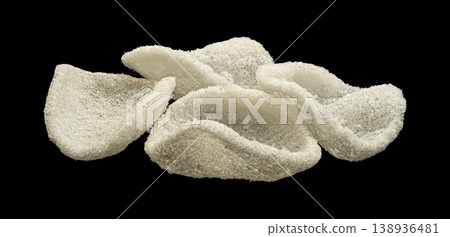 Japanese prawn crackers isolated on black background, traditional Asian restaurant snack, full depth of field Japanese prawn crackers isolated on black background, traditional Asian restaurant snack, full depth of field 138936481