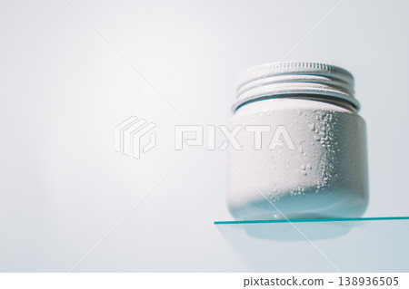 White cream jar on glass shelf White cream jar on glass shelf 138936505