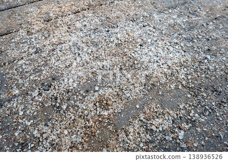 Sand and Salt Spread on Asphalt Surface for Winter Ice Safety Sand and Salt Spread on Asphalt Surface for Winter Ice Safety 138936526