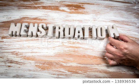 Menstruation Word Formed With Decorative Letters on Wooden Background Menstruation Word Formed With Decorative Letters on Wooden Background 138936536