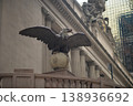 Bronze Eagle Watches Commuters Nearby. Guardian Eagle Sculpture Stands Tall Over City 138936692