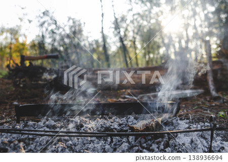Mystical Forest Scene with Lingering Bonfire Smoke Mystical Forest Scene with Lingering Bonfire Smoke 138936694