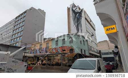 Cityscape view of graffiti-filled markets and buildings with huge art painting 138936718