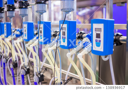 Automated goat milking suction machine with teat cups at exhibition 138936917