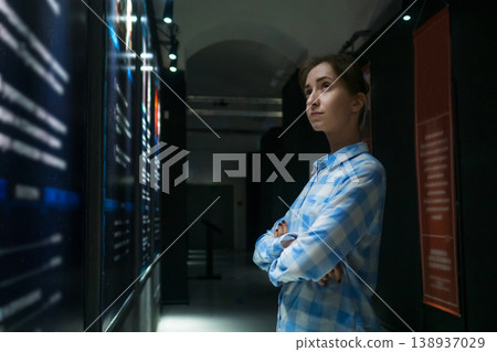 Young woman looking around in modern historical museum 138937029